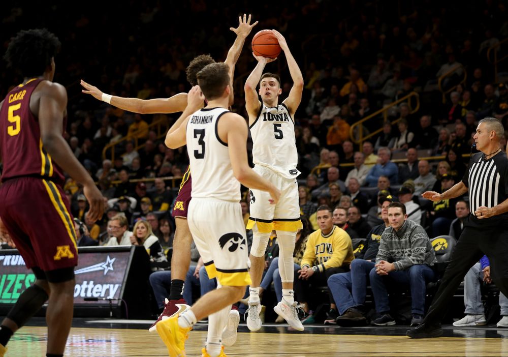 Iowa Hawkeyes guard CJ Fredrick (5) knocks down a three point basket against the Minnesota Golden Gophers Monday, December 9, 2019 at Carver-Hawkeye Arena. (Brian Ray/hawkeyesports.com)