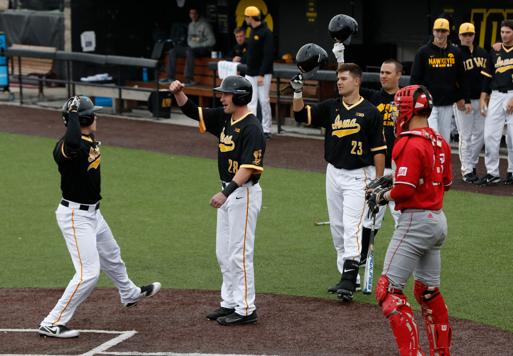 Iowa Hawkeyes catcher Austin Guzzo (20) and infielder Chris Whelan (28) against the Bradley Braves Wednesday, March 28, 2018 at Duane Banks Field. (Brian Ray/hawkeyesports.com)