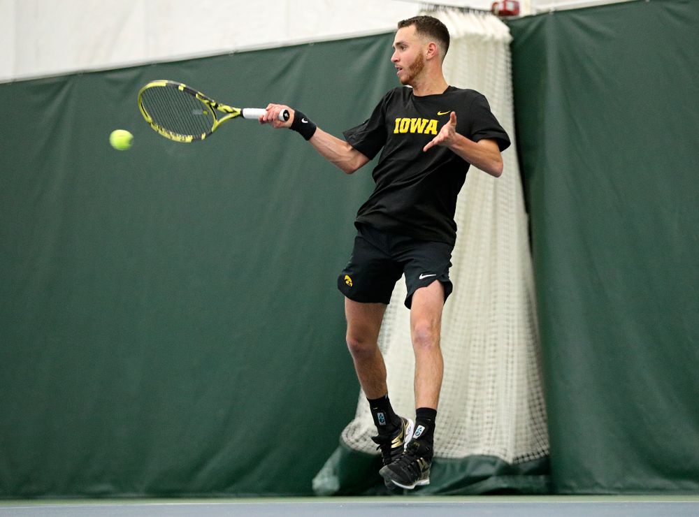 Iowa’s Kareem Allaf returns a shot during his singles match at the Hawkeye Tennis and Recreation Complex in Iowa City on Friday, February 14, 2020. (Stephen Mally/hawkeyesports.com)