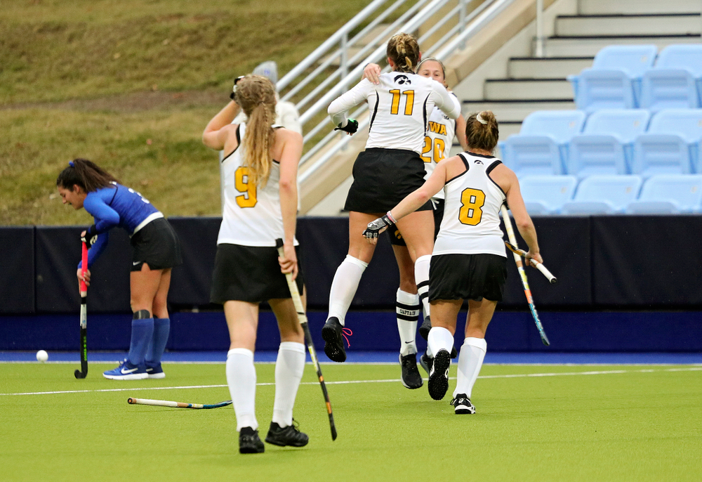 Iowa’s Katie Birch (11) celebrates with Sophie Sunderland (20) as Sofie Stribos (9) and Nikki Freeman (8) come running in after winning their NCAA Tournament First Round match against Duke at Karen Shelton Stadium in Chapel Hill, N.C. on Friday, Nov 15, 2019. (Stephen Mally/hawkeyesports.com)