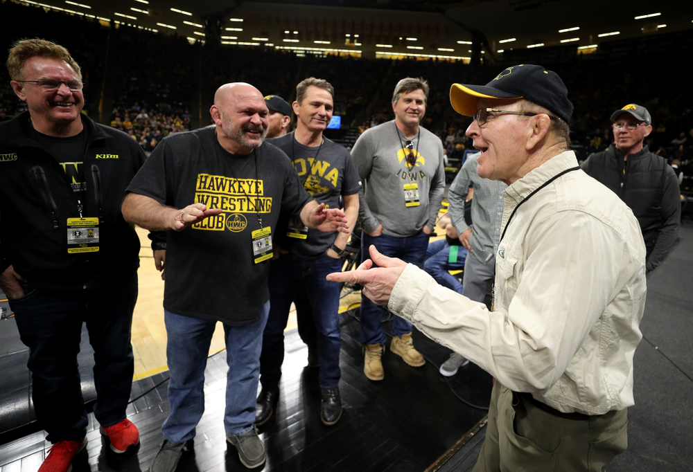 Legendary former head coach Dan Gable shakes hands with Iowa Wrestling alumni during the Iowa Hawkeyes dual against Oklahoma State Sunday, February 23, 2020 at Carver-Hawkeye Arena. (Brian Ray/hawkeyesports.com)