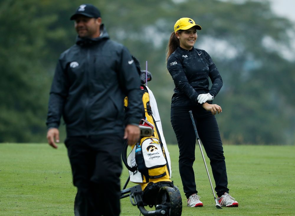 Iowa's Manuela Lizarazu laughs at a joke by assistant coach Michael Roters during the final round of the Diane Thomason Invitational at Finkbine Golf Course on September 30, 2018. (Tork Mason/hawkeyesports.com)