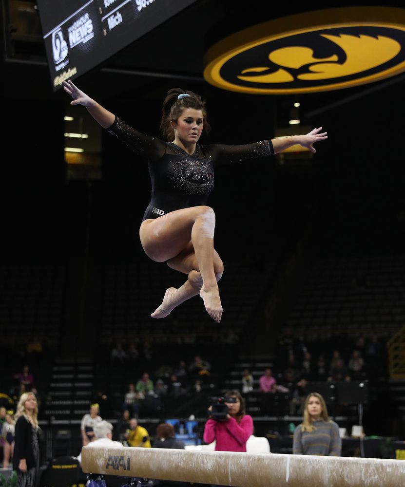 Iowa’s Erin Castle competes on the beam against Michigan Friday, February 14, 2020 at Carver-Hawkeye Arena. (Brian Ray/hawkeyesports.com)