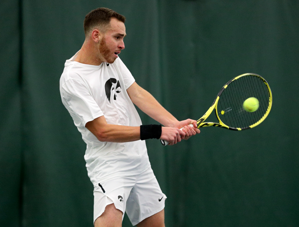 Iowa’s Kareem Allaf returns a shot during his singles match at the Hawkeye Tennis and Recreation Complex in Iowa City on Sunday, February 16, 2020. (Stephen Mally/hawkeyesports.com)