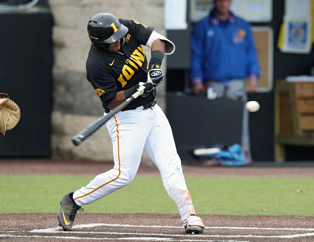 Iowa infielder Izaya Fullard (20) drives a pitch for a hit during the eighth inning of their college baseball game at Duane Banks Field in Iowa City on Tuesday, March 10, 2020. (Stephen Mally/hawkeyesports.com)