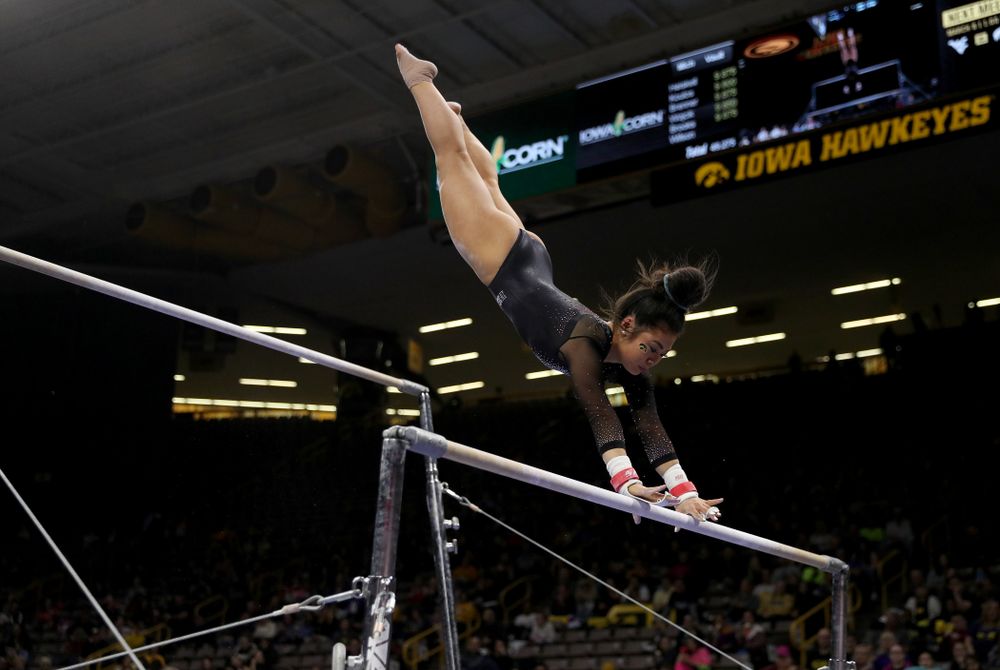 Iowa’s Clair Kaji competes on the bars against Michigan Friday, February 14, 2020 at Carver-Hawkeye Arena. (Brian Ray/hawkeyesports.com)