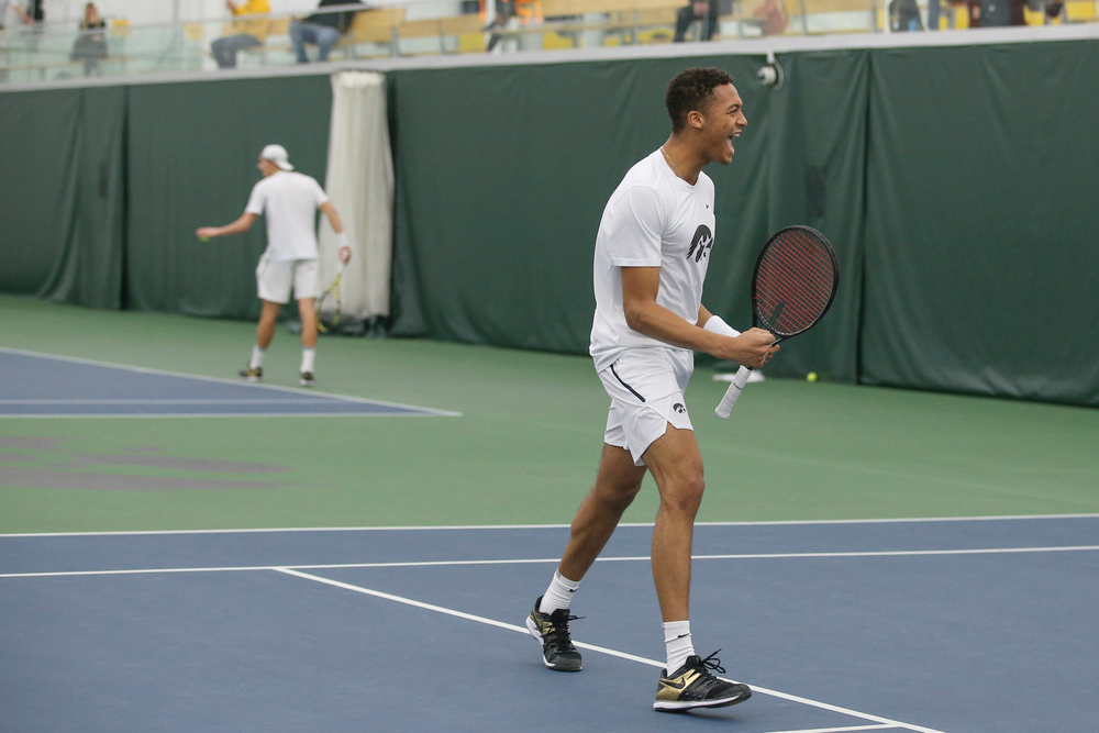 Iowa’s Oliver Okonkwo celebrates a point during the Iowa men’s tennis meet vs Nebraska on Sunday, March 1, 2020 at the Hawkeye Tennis and Recreation Complex. (Lily Smith/hawkeyesports.com)