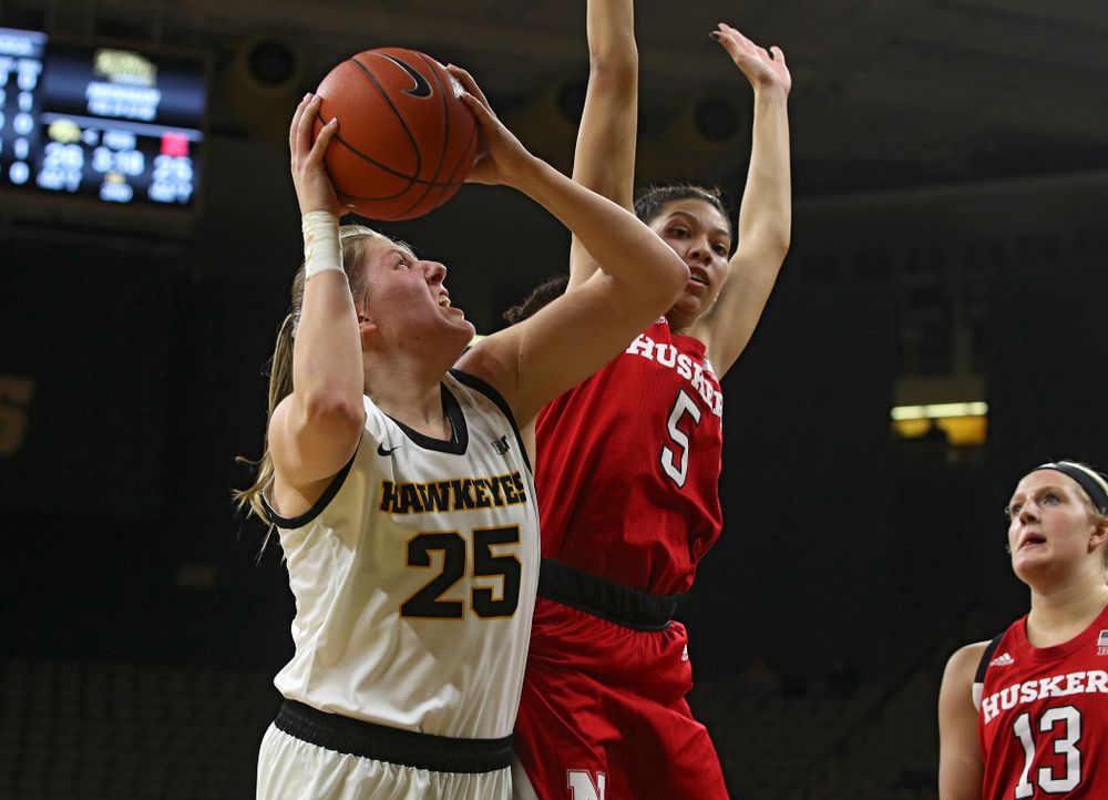 Iowa Hawkeyes forward Monika Czinano (25) makes a basket while being fouled during the second quarter of the game at Carver-Hawkeye Arena in Iowa City on Thursday, February 6, 2020. (Stephen Mally/hawkeyesports.com)