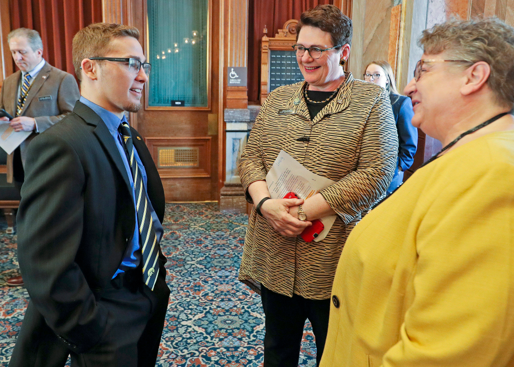 Iowa's Spencer Lee (from left) talks with State Rep. Vicki Lensing and State Rep. Mary Mascher before being honored in the House Chamber at the Iowa State Capitol Building on Tuesday, Apr. 9, 2019. (Stephen Mally/hawkeyesports.com)