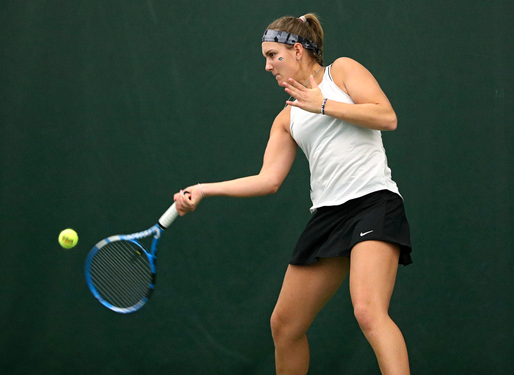 Iowa’s Ashleigh Jacobs returns a shot during her singles match at the Hawkeye Tennis and Recreation Complex in Iowa City on Sunday, February 16, 2020. (Stephen Mally/hawkeyesports.com)
