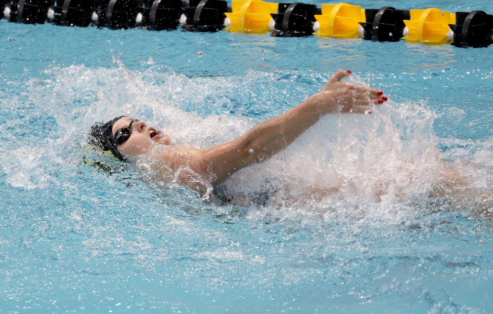 IowaÕs Julia Koluch competes in the 100 yard backstroke against Notre Dame and Illinois Saturday, January 11, 2020 at the Campus Recreation and Wellness Center. (Brian Ray/hawkeyesports.com)