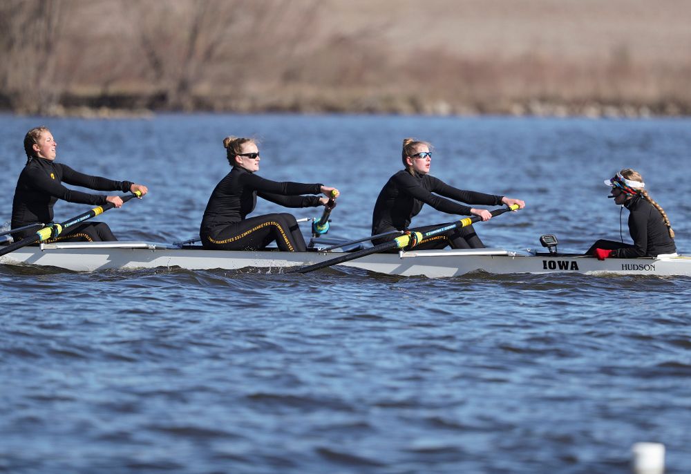 Iowa's Molly Rygh (from left), Kirsten Jurgersen, Amelia Juhl, and Alexis Wolf during their I Novice 8 race against Wisconsin in their Big Ten Double Dual Rowing Regatta at Lake Macbride in Solon on Saturday, Apr. 13, 2019. (Stephen Mally/hawkeyesports.com)