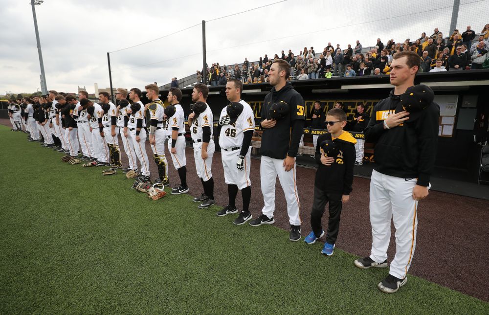 Garret Nichols stands with the rest of the team for the National Anthem before the Iowa Hawkeyes game against Michigan State Sunday, May 12, 2019 at Duane Banks Field. (Brian Ray/hawkeyesports.com)