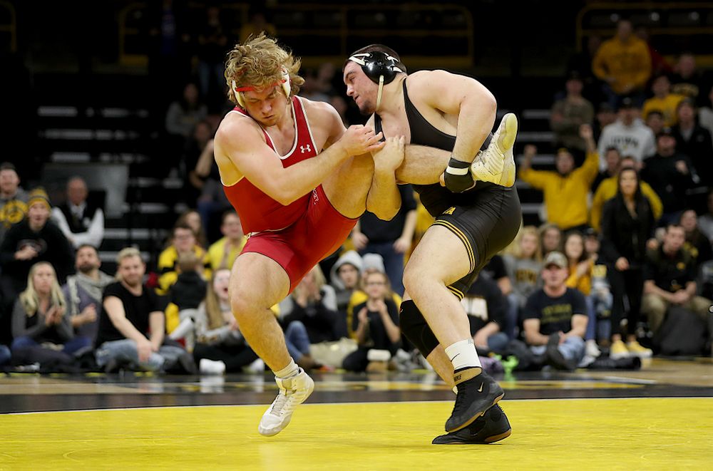 IowaÕs Tony Cassioppi wrestles WisconsinÕs Trent Hillger at heavyweight Sunday, December 1, 2019 at Carver-Hawkeye Arena. Cassioppi won the match 3-2. (Brian Ray/hawkeyesports.com)
