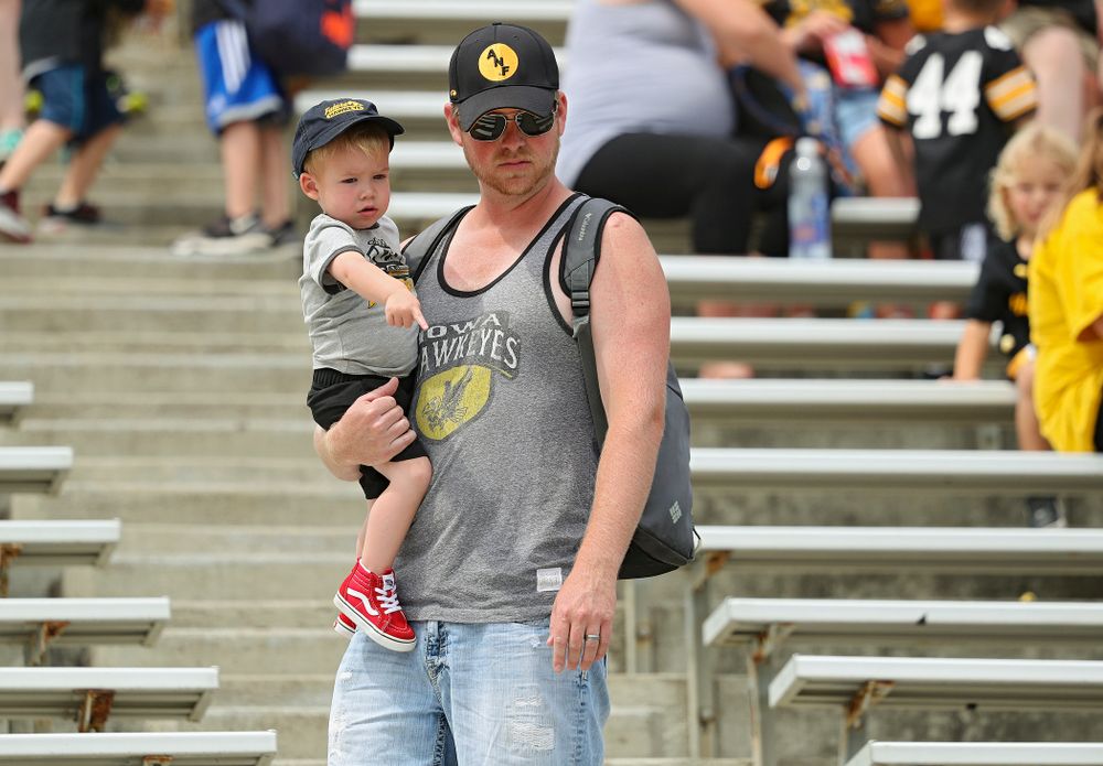 A young fan points to the row he wants to sit in during Fall Camp Practice No. 8 at Kids Day at Kinnick Stadium in Iowa City on Saturday, Aug 10, 2019. (Stephen Mally/hawkeyesports.com)