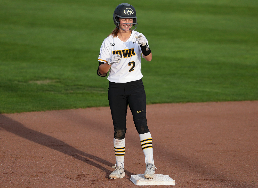 Iowa second baseman Aralee Bogar (2) points into the dugout after hitting a double during the fifth inning of their game against Ohio State at Pearl Field in Iowa City on Friday, May. 3, 2019. (Stephen Mally/hawkeyesports.com)