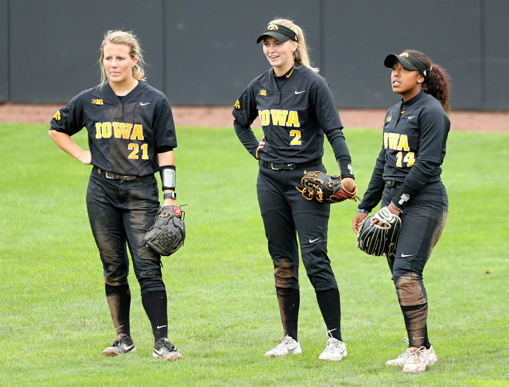 Iowa outfielder Havyn Monteer (21), Aralee Bogar (2), and Nia Carter (14) during the sixth inning of their game against Iowa Softball vs Indian Hills Community College at Pearl Field in Iowa City on Sunday, Oct 6, 2019. (Stephen Mally/hawkeyesports.com)