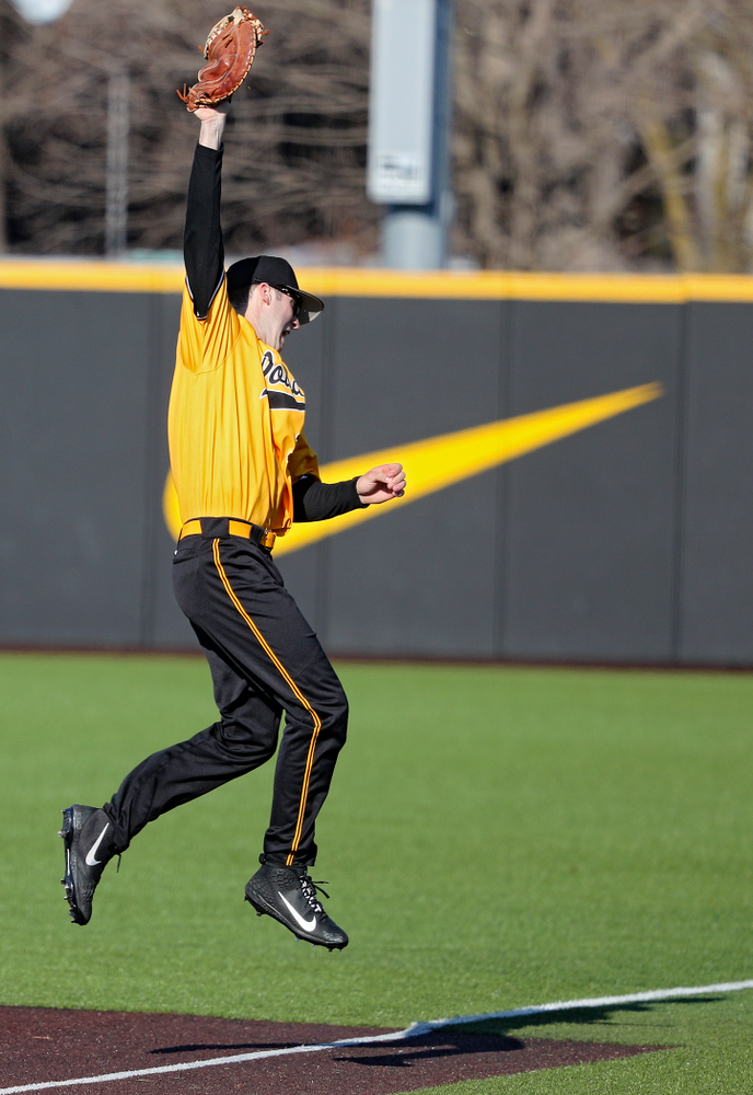 Iowa Hawkeyes first baseman Connor McCaffery (30) snags a line drive for an out during the fourth inning of their game at Duane Banks Field in Iowa City on Tuesday, Apr. 2, 2019. (Stephen Mally/hawkeyesports.com)