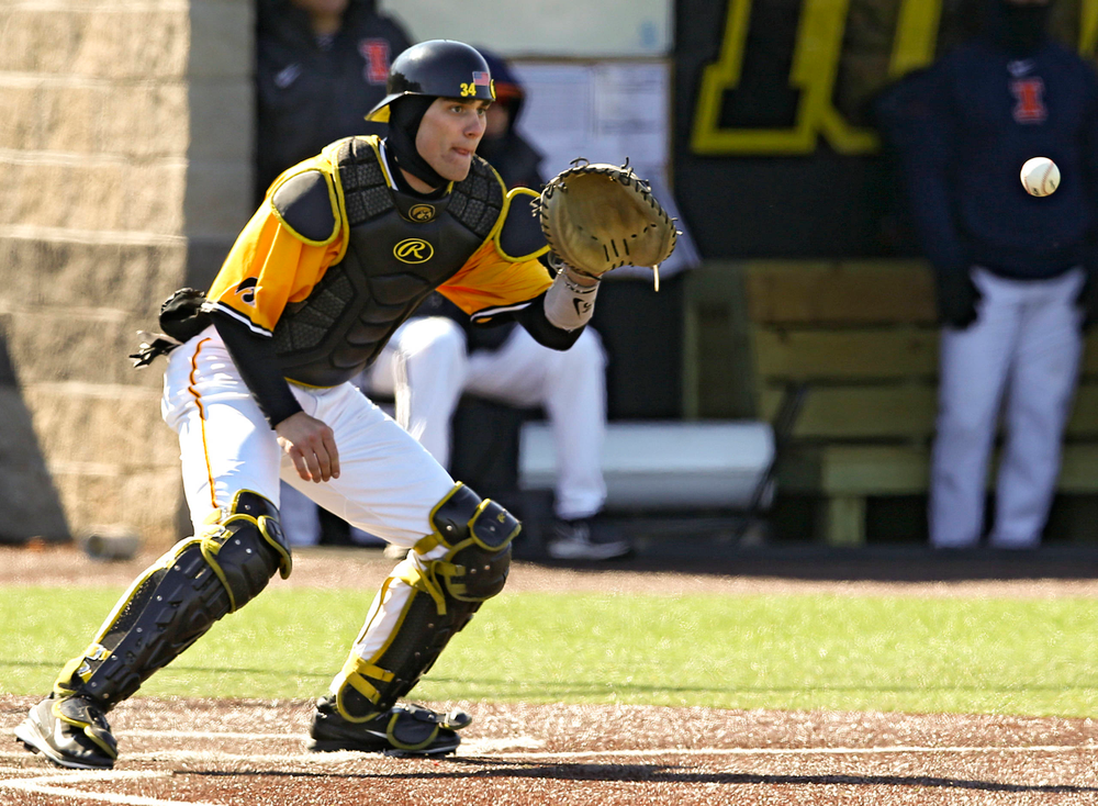 Iowa Hawkeyes catcher Austin Martin (34) pulls in a throw at the plate in the middle of an inning ending double play during the eighth inning against Illinois at Duane Banks Field in Iowa City on Sunday, Mar. 31, 2019. (Stephen Mally/hawkeyesports.com)