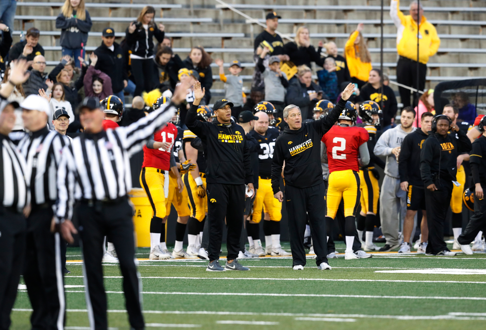 Iowa Hawkeyes head coach Kirk Ferentz and special teams coach LeVar Woods wave to patients in the Stead Family Children's Hospital during Iowa Football's final spring practice Friday, April 20, 2018 at Kinnick Stadium. (Brian Ray/hawkeyesports.com)