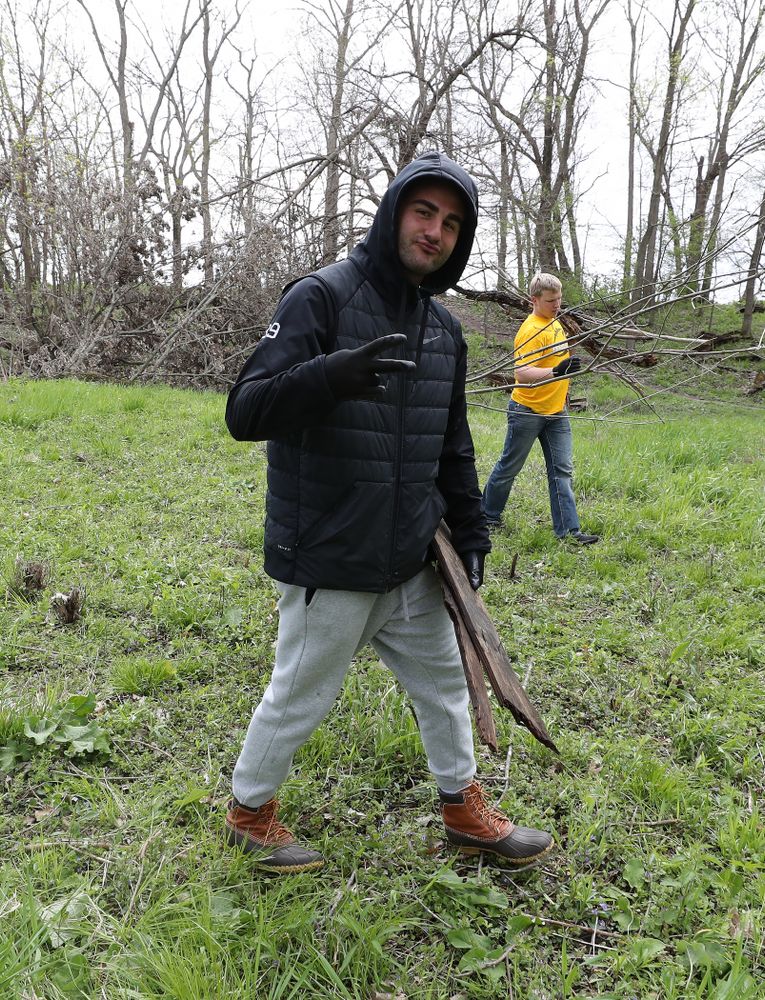 Members of the Hawkeye Football team volunteer with the Iowa City Public Works department along the Iowa River during the annual Iowa Athletics Day of Caring Sunday, April 28, 2019 in Iowa City. (Brian Ray/hawkeyesports.com)