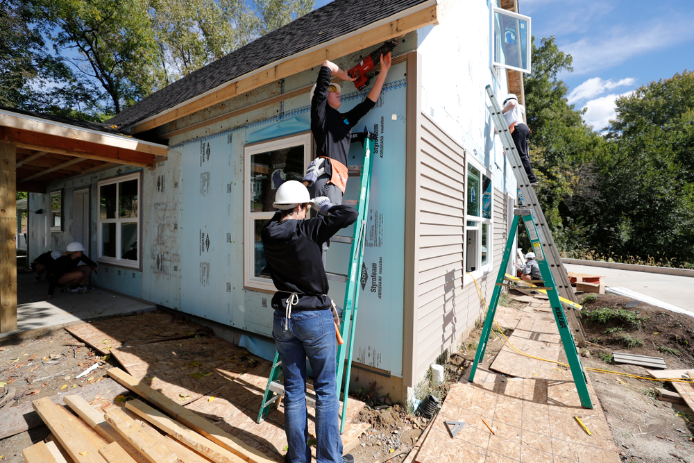 Iowa Hawkeyes forward Amanda Ollinger (43) works on the Habitat for Humanity Women's Build Wednesday, September 26, 2018 in Iowa City. (Brian Ray/hawkeyesports.com)