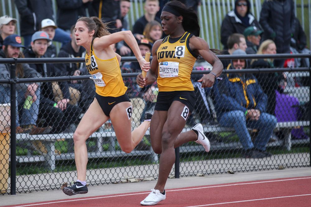 Iowa's Talia Buss and Antonise Christian during women's 4x100 meter relay at Big Ten Outdoor Track and Field Championships at Francis X. Cretzmeyer Track on Sunday, May 12, 2019. (Lily Smith/hawkeyesports.com)