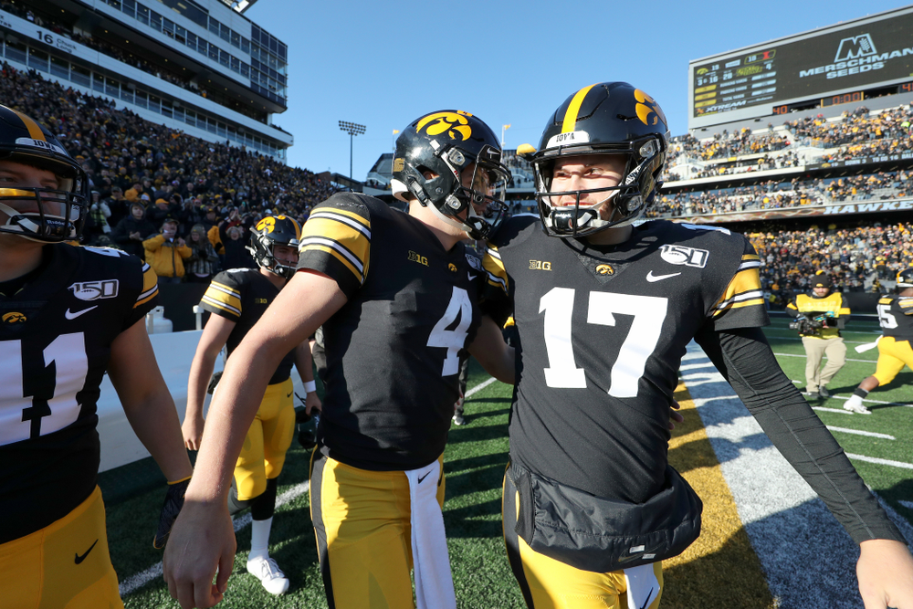 Iowa Hawkeyes quarterback Nate Stanley (4) and quarterback Ryan Schmidt (17) against the Illinois Fighting Illini Saturday, November 23, 2019 at Kinnick Stadium. (Brian Ray/hawkeyesports.com)