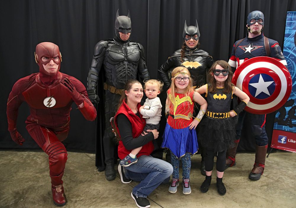 Fans get a picture with a group of superheroes on Superhero and Princess Day before the meet at Carver-Hawkeye Arena in Iowa City on Sunday, March 8, 2020. (Stephen Mally/hawkeyesports.com)