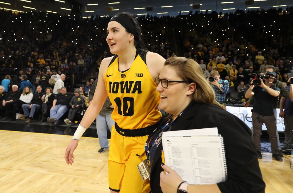 Iowa Hawkeyes forward Megan Gustafson (10) and SID Brandee Britt against the Northwestern Wildcats Sunday, March 3, 2019 at Carver-Hawkeye Arena. (Brian Ray/hawkeyesports.com)