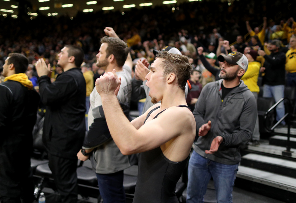IowaÕs Spencer Lee cheers on teammate Austin DeSanto as he wrestles WisconsinÕs Seth Gross at 133 pounds Sunday, December 1, 2019 at Carver-Hawkeye Arena. DeSanto won the match 6-2. (Brian Ray/hawkeyesports.com)