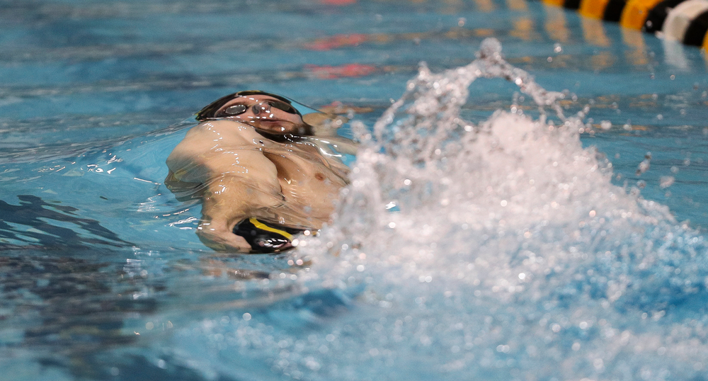 Iowa's Kenneth Mende competes in the 100-yard backstroke during the third day of the Hawkeye Invitational at the Campus Recreation and Wellness Center on November 16, 2018. (Tork Mason/hawkeyesports.com)