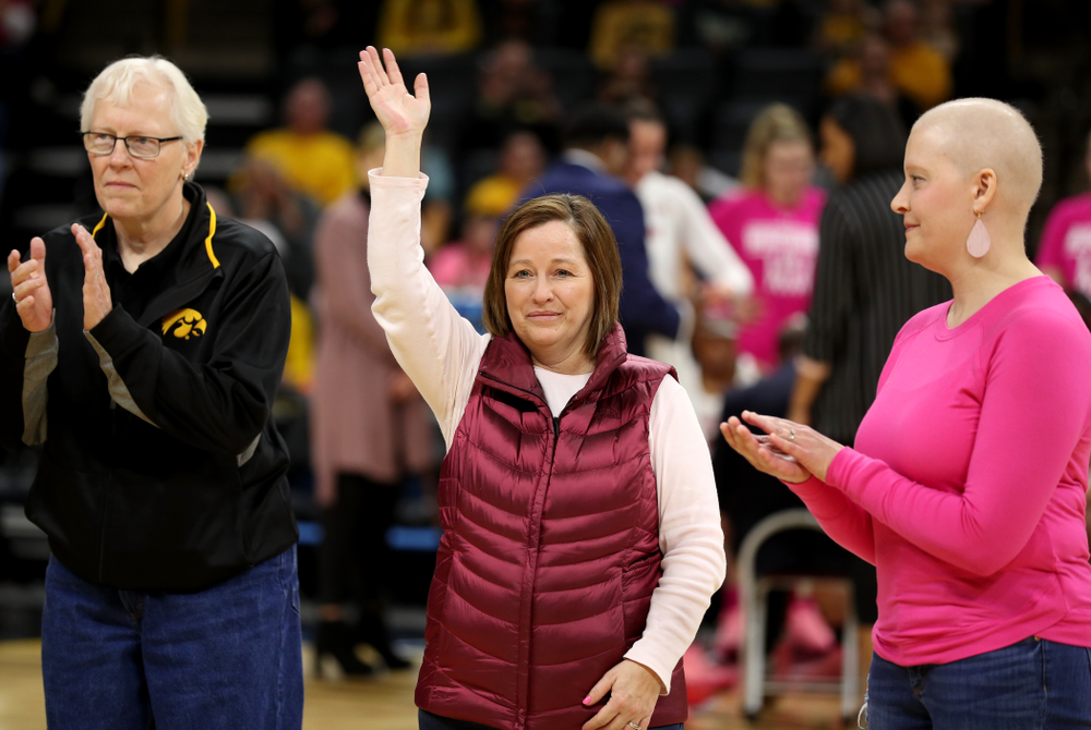Women affected by cancer are introduced during the Iowa Hawkeyes game against the Wisconsin Badgers Sunday, February 16, 2020 at Carver-Hawkeye Arena. (Brian Ray/hawkeyesports.com)