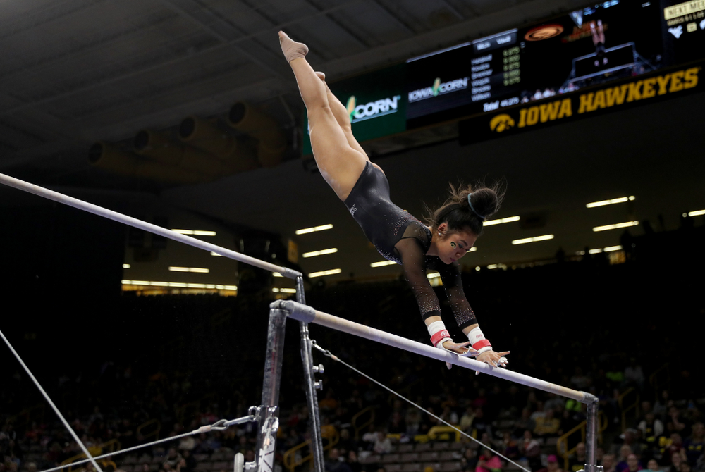 Iowa’s Clair Kaji competes on the bars against Michigan Friday, February 14, 2020 at Carver-Hawkeye Arena. (Brian Ray/hawkeyesports.com)