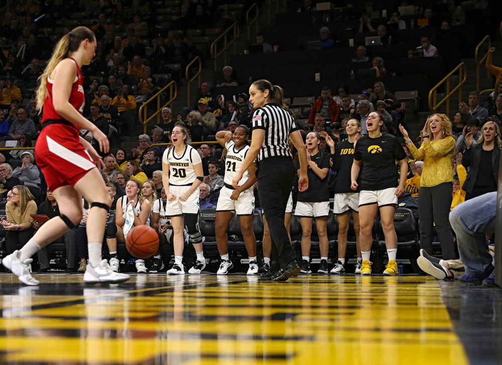 The Iowa Hawkeyes bench celebrates after forward Amanda Ollinger (not pictured) make a basket during the fourth quarter of the game at Carver-Hawkeye Arena in Iowa City on Thursday, February 6, 2020. (Stephen Mally/hawkeyesports.com)