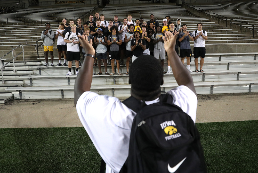 Iowa Hawkeyes defensive tackle Daviyon Nixon (54) leads the new players in the ÒFight SongÓ Thursday, August 22, 2019 at Kinnick Stadium in Iowa City. (Brian Ray/hawkeyesports.com)