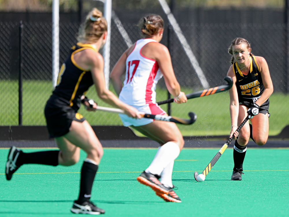 Iowa’s Maddy Murphy (26) looks to pass to Nikki Freeman (8) during the first quarter of their match at Grant Field in Iowa City on Friday, Oct 4, 2019. (Stephen Mally/hawkeyesports.com)