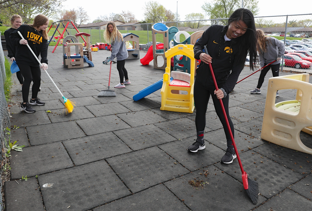 Iowa women's gymnasts clean outside Handicare during the 21st annual ISAAC Hawkeye Day of Caring in Coralville on Sunday, Apr. 28, 2019. (Stephen Mally/hawkeyesports.com)