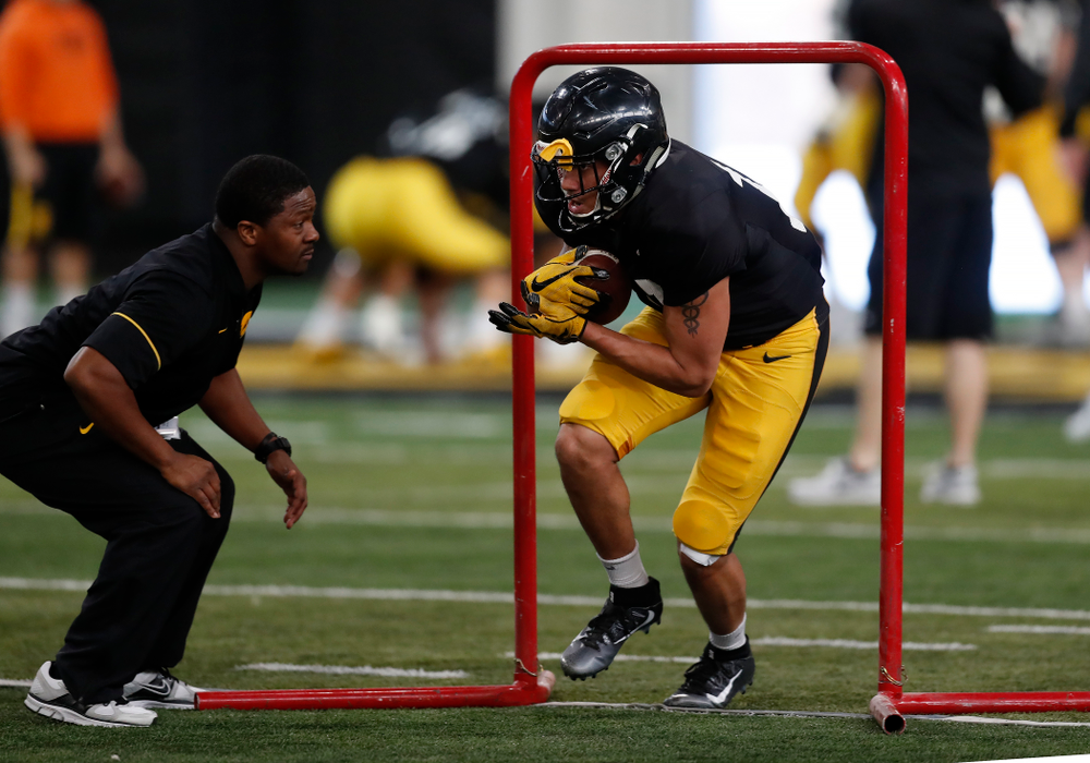 Iowa Hawkeyes running back Camron Harrell (10) and running backs coach Derrick Foster during spring practice Wednesday, March 28, 2018 at the Hansen Football Performance Center. (Brian Ray/hawkeyesports.com)