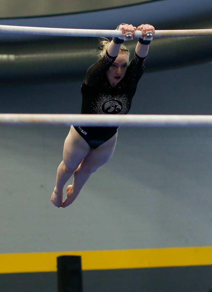 Annabelle Moser competes on the uneven bars during the Black and Gold Intrasquad meet at the Field House on 12/2/17. (Tork Mason/hawkeyesports.com)