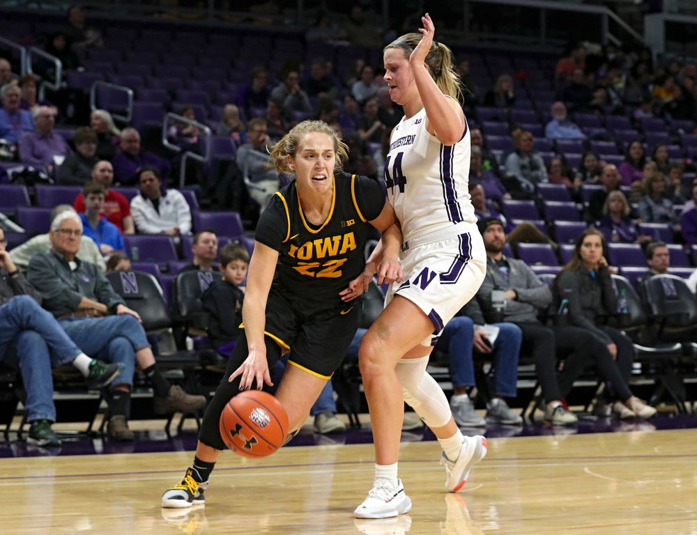 Iowa Hawkeyes guard Kathleen Doyle (22) drives to the hoop during the third quarter of their game at Welsh-Ryan Arena in Evanston, Ill. on Sunday, January 5, 2020. (Stephen Mally/hawkeyesports.com)
