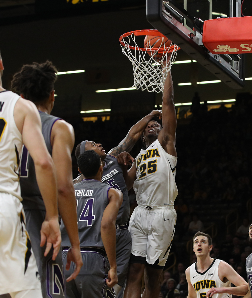 Iowa Hawkeyes forward Tyler Cook (25) draws a foul against the Northwestern Wildcats Sunday, February 10, 2019 at Carver-Hawkeye Arena. (Brian Ray/hawkeyesports.com)