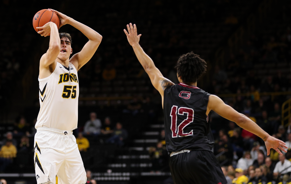 Iowa Hawkeyes forward Luka Garza (55) puts up a 3-pointer during a game against Guilford College at Carver-Hawkeye Arena on November 4, 2018. (Tork Mason/hawkeyesports.com)