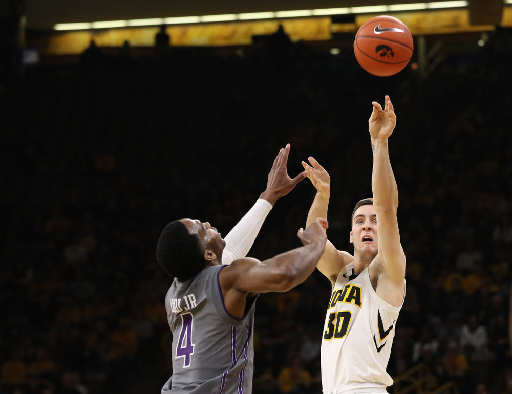 Iowa Hawkeyes guard Connor McCaffery (30) makes a three point basket against the Northwestern Wildcats Sunday, February 10, 2019 at Carver-Hawkeye Arena. (Brian Ray/hawkeyesports.com)