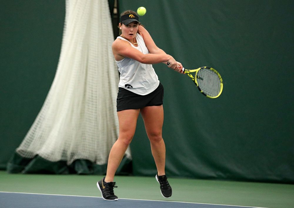 Iowa’s Danielle Bauers returns a shot during her singles match at the Hawkeye Tennis and Recreation Complex in Iowa City on Sunday, February 23, 2020. (Stephen Mally/hawkeyesports.com)