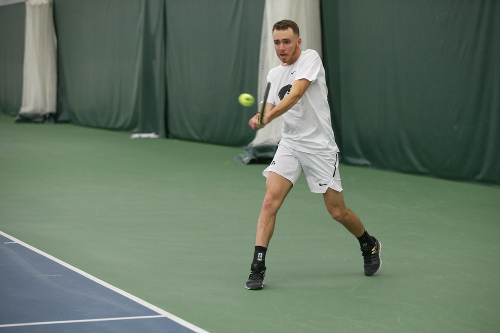 Iowa’s Kareem Allaf returns a hit during the Iowa men’s tennis meet vs Nebraska on Sunday, March 1, 2020 at the Hawkeye Tennis and Recreation Complex. (Lily Smith/hawkeyesports.com)