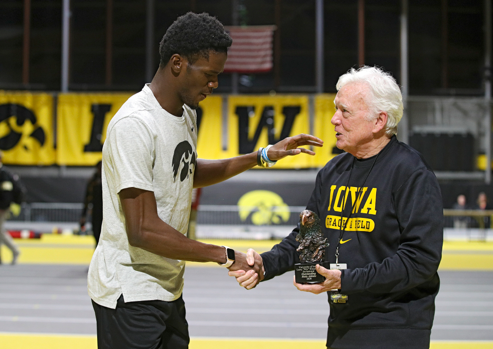 Iowa’s Wayne Lawrence Jr. (from left) receives an award from Larry Wieczorek during the Larry Wieczorek Invitational at the Recreation Building in Iowa City on Saturday, January 18, 2020. (Stephen Mally/hawkeyesports.com)