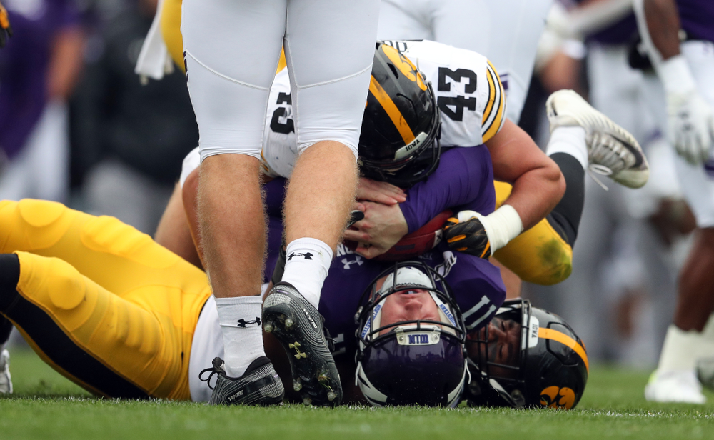 Iowa Hawkeyes linebacker Dillon Doyle (43) and defensive end Chauncey Golston (57) against the Northwestern Wildcats Saturday, October 26, 2019 at Ryan Field in Evanston, Ill. (Brian Ray/hawkeyesports.com)