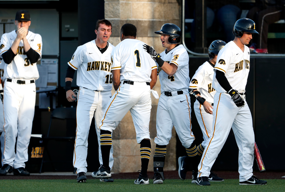 Iowa Hawkeyes third baseman Lorenzo Elion (1), infielder Mitchell Boe (4), and infielder Tanner Wetrich (16) against the Michigan Wolverines Friday, April 27, 2018 at Duane Banks Field in Iowa City. (Brian Ray/hawkeyesports.com)