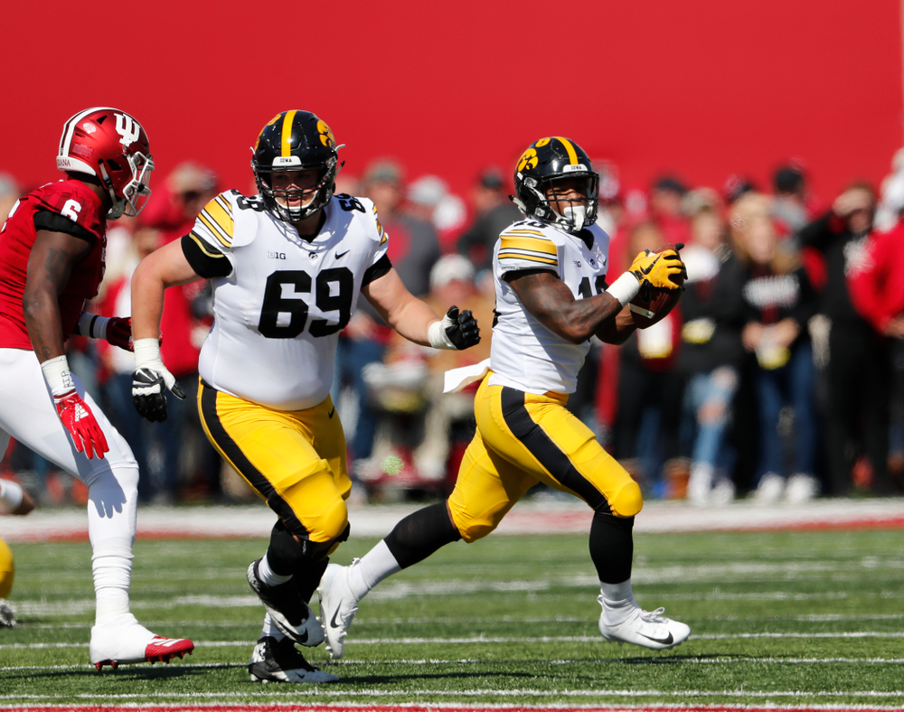 Iowa Hawkeyes running back Mekhi Sargent (10) and offensive lineman Keegan Render (69) against the Indiana Hoosiers Saturday, October 13, 2018 at Memorial Stadium, in Bloomington, Ind. (Brian Ray/hawkeyesports.com)